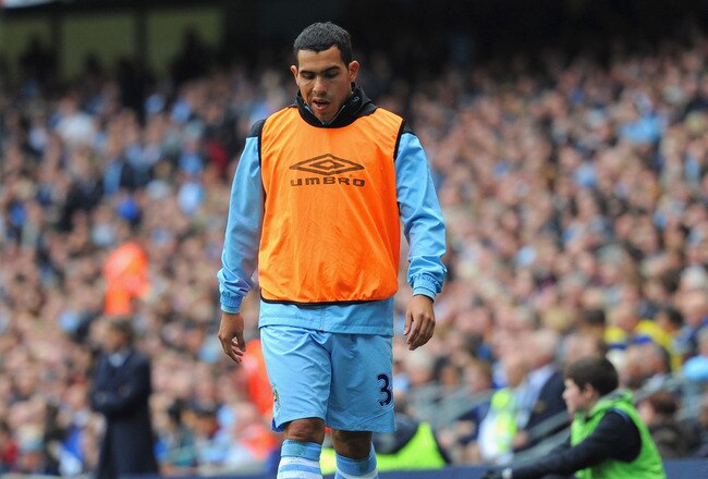 MANCHESTER, ENGLAND - SEPTEMBER 24:  Carlos Tevez of Manchester City looks on from the sidelines during the Barclays Premier League match between Manchester City and Everton at the Etihad Stadium on September 24, 2011 in Manchester, England.  (Photo by Michael Regan/Getty Images)