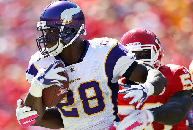 KANSAS CITY, MO - OCTOBER 02:  Adrian Peterson #28 of the Minnesota Vikings carries the ball as linebacer Justin Houston #50 of the Kansas City Chiefs defends during the game on October 2, 2011 at Arrowhead Stadium in Kansas City, Missouri.  (Photo by Jamie Squire/Getty Images)