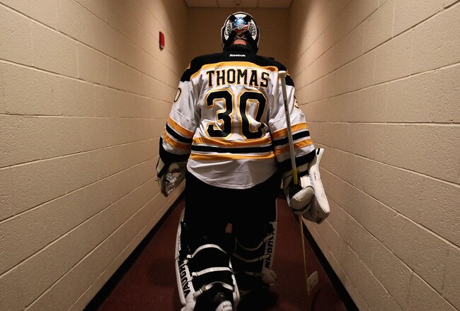 GLENDALE, AZ - DECEMBER 28:  Goaltender Tim Thomas #30 of the Boston Bruins walks back to the locker room before the NHL game against the Phoenix Coyotes at Jobing.com Arena on December 28, 2011 in Glendale, Arizona.  (Photo by Christian Petersen/Getty Images)