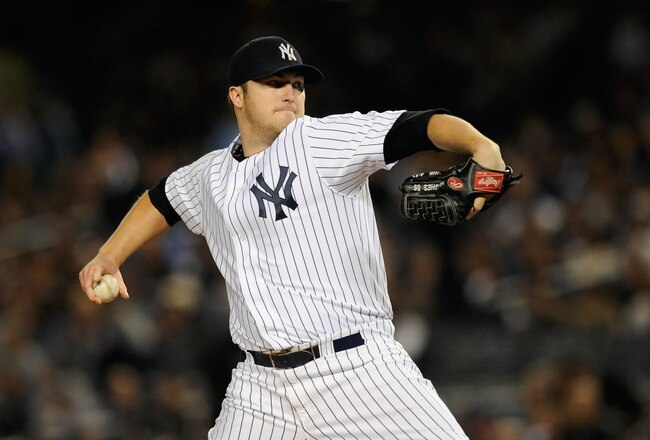 NEW YORK, NY - OCTOBER 06:  Phil Hughes #65 of the New York Yankees throws a pitch against the Detroit Tigers during Game Five of the American League Championship Series at Yankee Stadium on October 6, 2011 in the Bronx borough of New York City.  (Photo by Patrick McDermott/Getty Images)