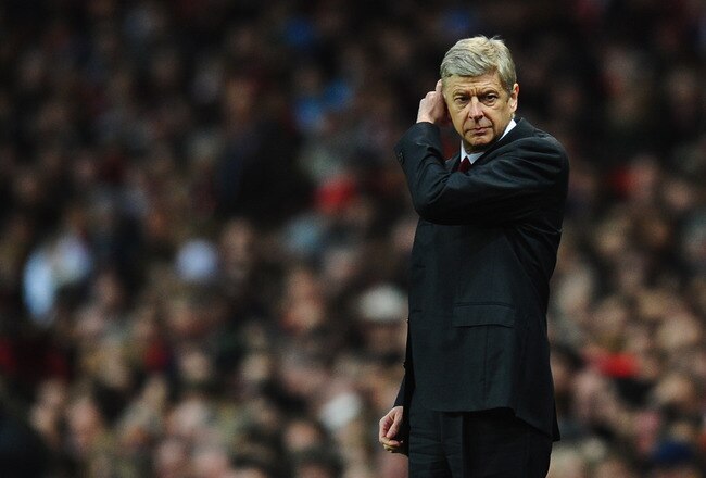 LONDON, ENGLAND - JANUARY 22:  Arsene Wenger manager of Arsenal looks thoughtful during the Barclays Premier League match between Arsenal and Manchester United at Emirates Stadium on January 22, 2012 in London, England.  (Photo by Mike Hewitt/Getty Images)