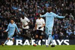 MANCHESTER, ENGLAND - JANUARY 22:  Mario Balotelli of Manchester City celebrates scoring his team's third goal from a penalty during the Barclays Premier League match between Manchester City and Tottenham Hotspur at the Etihad Stadium on January 22, 2012 in Manchester, England.  (Photo by Alex Livesey/Getty Images)