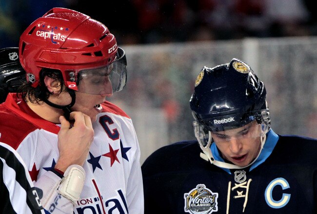 PITTSBURGH, PA - JANUARY 01:  Alex Ovechkin #8 of the Washington Capitals and Sidney Crosby #81 of the Pittsburgh Penguins are seen during the 2011 NHL Bridgestone Winter Classic at Heinz Field on January 1, 2011 in Pittsburgh, Pennsylvania. Washington won 3-1. (Photo by Jamie Squire/Getty Images)