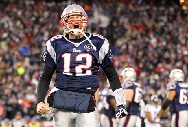 FOXBORO, MA - JANUARY 22:  Tom Brady #12 of the New England Patriots celebrates after scoring a touchdown in the fourth quarter against the Baltimore Ravens during their AFC Championship Game at Gillette Stadium on January 22, 2012 in Foxboro, Massachusetts.  (Photo by Jim Rogash/Getty Images)