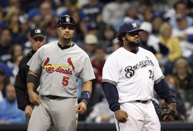 MILWAUKEE, WI - OCTOBER 16:  (L-R) Albert Pujols #5 of the St. Louis Cardinals and Prince Fielder #28 of the Milwaukee Brewers stand on first base after Pujols hit a RBI single in the top of the eighth inning during Game Six of the National League Championship Series at Miller Park on October 16, 2011 in Milwaukee, Wisconsin.  (Photo by Christian Petersen/Getty Images)