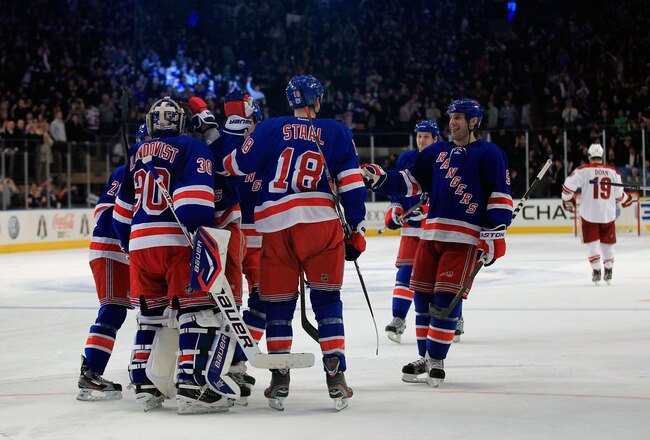 NEW YORK, NY - JANUARY 10:  Henrik Lundqvist #30 of the New York Rangers is congratulated for his game winning save against Shane Doan #19 of the Phoenix Coyotes in a penalty shoot out at Madison Square Garden on January 10, 2012 in New York City.  (Photo by Chris Trotman/Getty Images)