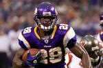 MINNEAPOLIS, MN - SEPTEMBER 18: Adrian Peterson #28 of the Minnesota Vikings avoids a tackle by Cody Grimm #35 of the Tampa Bay Buccaneers in the second quarter on September 18, 2011 at Hubert H. Humphrey Metrodome in Minneapolis, Minnesota. Peterson scored on the play. (Photo by Hannah Foslien/Getty Images)