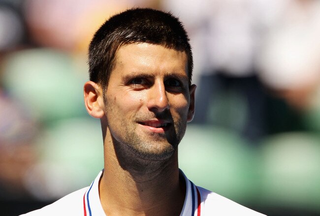 MELBOURNE, AUSTRALIA - JANUARY 19:  Novak Djokovic of Serbia looks on in his second round match against Santiago Giraldo of Colombia during day four of the 2012 Australian Open at Melbourne Park on January 19, 2012 in Melbourne, Australia.  (Photo by Scott Barbour/Getty Images)