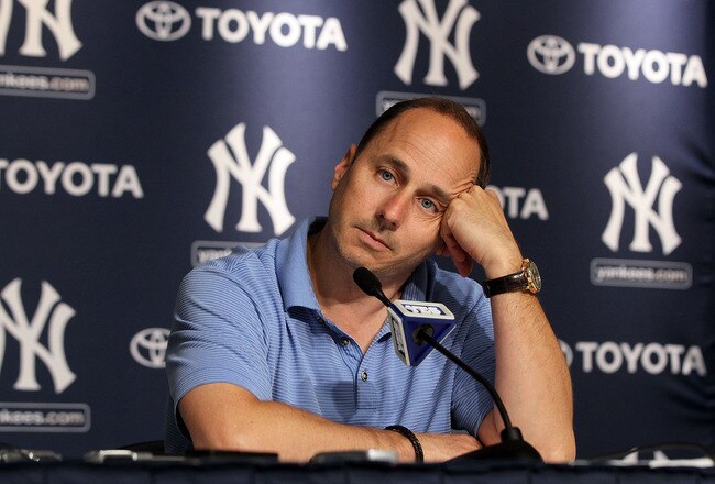 NEW YORK, NY - JULY 08:  General manager Brian Cashman of the New York Yankees speaks to the media after the game against the Tampa Bay Rays was postponed due to rain on July 8, 2011 at Yankee Stadium in the Bronx borough of New York City.  (Photo by Jim McIsaac/Getty Images)