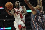CHICAGO, IL - JANUARY 21:  Loul Deng #9 of the Chicago Bulls drives to the basket against Boris Diaw #32 of the Charlotte Bobcats at the United Center on January 21, 2012 in Chicago, Illinois. The Bulls defeated the Bobcats 95-89. NOTE TO USER: User expressly acknowledges and agrees that, by downloading and or using this photograph, User is consenting to the terms and conditions of the Getty Images License Agreement.  (Photo by Jonathan Daniel/Getty Images)