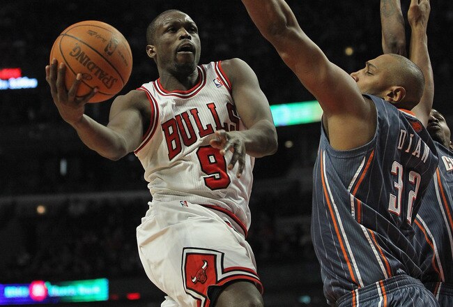 CHICAGO, IL - JANUARY 21:  Loul Deng #9 of the Chicago Bulls drives to the basket against Boris Diaw #32 of the Charlotte Bobcats at the United Center on January 21, 2012 in Chicago, Illinois. The Bulls defeated the Bobcats 95-89. NOTE TO USER: User expressly acknowledges and agrees that, by downloading and or using this photograph, User is consenting to the terms and conditions of the Getty Images License Agreement.  (Photo by Jonathan Daniel/Getty Images)