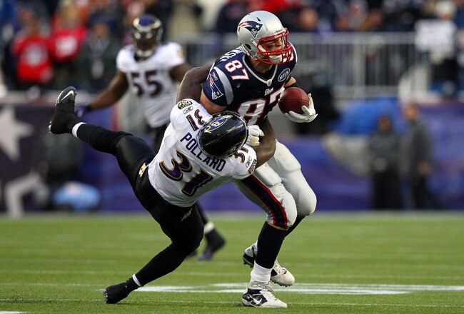 FOXBORO, MA - JANUARY 22:  Rob Gronkowski #87 of the New England Patriots gets tackle by Bernard Pollard #31 of the Baltimore Ravens during their AFC Championship Game at Gillette Stadium on January 22, 2012 in Foxboro, Massachusetts.  (Photo by Al Bello/Getty Images)
