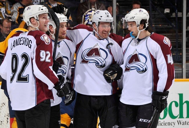 NASHVILLE, TN - JANUARY 12:  Gabriel Landeskog #92, Ryan O'Reilly #37, Milan Hejduk #23, and Stefan Elliott #46 of the Colorado Avalanche celebrate after a goal against the Nashville Predators at the Bridgestone Arena on January 12, 2012 in Nashville, Tennessee.  (Photo by Frederick Breedon/Getty Images)