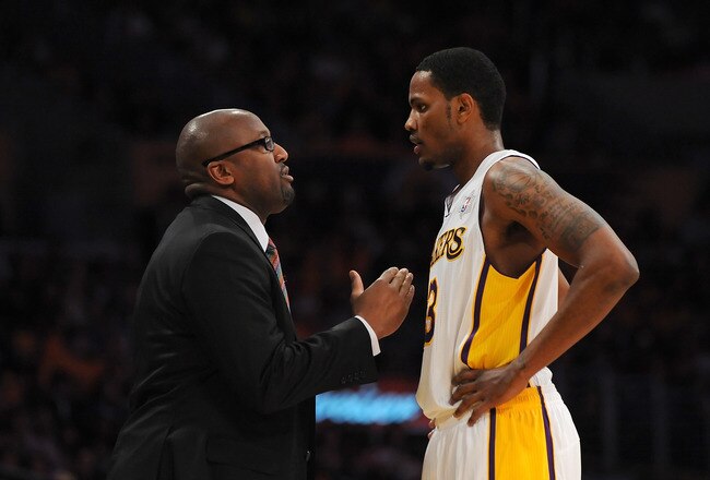 LOS ANGELES - DECEMBER 25:  Head coach Mike Brown talks with Devin Ebanks #3 of the Los Angeles Lakers during the game against the Chicago Bulls at Staples Center on December 25, 2011 in Los Angeles, California.  NOTE TO USER: User expressly acknowledges and agrees that, by downloading and or using this photograph, User is consenting to the terms and conditions of the Getty Images License Agreement.  (Photo by Lisa Blumenfeld/Getty Images)
