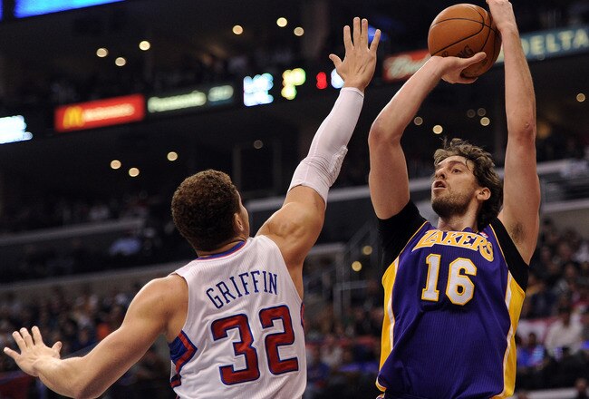 LOS ANGELES, CA - JANUARY 14:  Pau Gasol #16 of the Los Angeles Lakers takes shoots a jumper in front of Blake Griffin #32 of the Los Angeles Clippers at Staples Center on January 14, 2012 in Los Angeles, California.  NOTE TO USER: User expressly acknowledges and agrees that, by downloading and/or using this Photograph, user is consenting to the terms and conditions of the Getty Images License Agreement.  (Photo by Harry How/Getty Images)