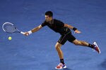 MELBOURNE, AUSTRALIA - JANUARY 23:  Novak Djokovic of Serbia plays a forehand in his fourth round match against Lleyton Hewitt of Australia during day eight of the 2012 Australian Open at Melbourne Park on January 23, 2012 in Melbourne, Australia.  (Photo by Quinn Rooney/Getty Images)