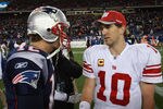 FOXBORO, MA - NOVEMBER 6:    Tom Brady #12 of the New England Patriots congratulates  Eli Manning #10 of the New York Giants after the New York Giants 24-20 win on November 6, 2011 in Foxboro, Massachusetts. (Photo by Jim Rogash/Getty Images)