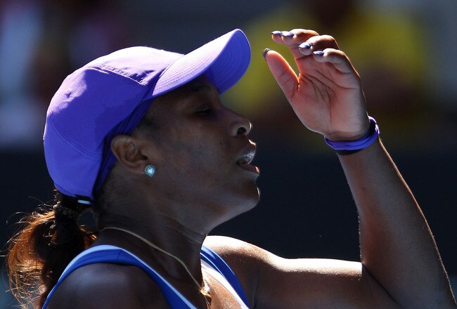 MELBOURNE, AUSTRALIA - JANUARY 23:  Serena Williams of the United States of America reacts in her fourth round match against Ekaterina Makarova of Russia during day eight of the 2012 Australian Open at Melbourne Park on January 23, 2012 in Melbourne, Australia.  (Photo by Mark Kolbe/Getty Images)