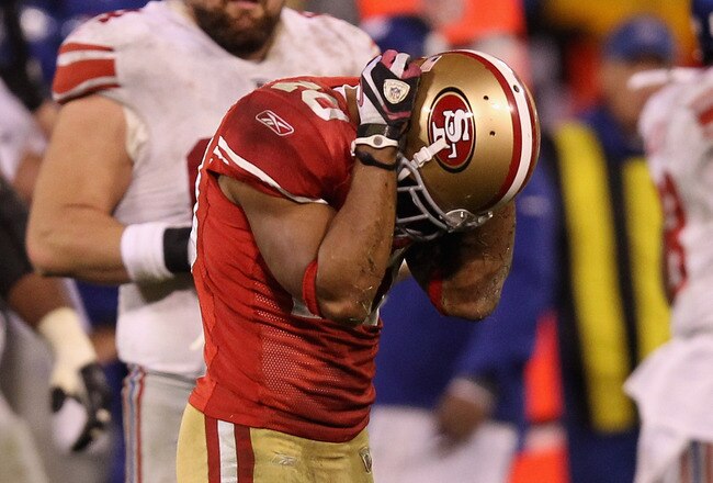 SAN FRANCISCO, CA - JANUARY 22:  Kyle Williams #10 of the San Francisco 49ers reacts after fumbling the ball in overtime of the NFC Championship Game against the New York Giants at Candlestick Park on January 22, 2012 in San Francisco, California. The Giants beat the 49ers 20-17 in overtime.  (Photo by Ezra Shaw/Getty Images)