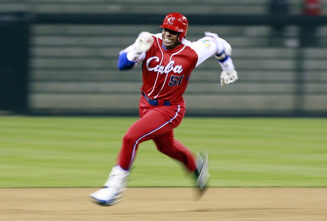 SAN DIEGO - MARCH 18: Yoennis Cespedes #51 of Cuba runs to third base after hitting into the corner of the outfield againts Japan during the 2009 World Baseball Classic Round 2 Pool 1 Game 5 on March 18, 2009 at Petco Park in San Diego, California.  (Photo by Jeff Bottari/Getty Images)