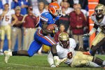 GAINESVILLE, FL - NOVEMBER 26:  Running back Chris Rainey #1 of the Florida Gators rushes upfield against the Florida State Seminoles November 26, 2011 at Ben Hill Griffin Stadium in Gainesville, Florida.  FSU won 21 - 7.  (Photo by Al Messerschmidt/Getty Images)