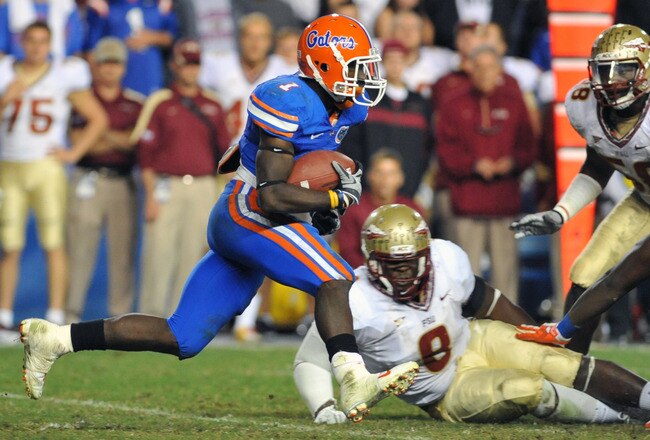 GAINESVILLE, FL - NOVEMBER 26:  Running back Chris Rainey #1 of the Florida Gators rushes upfield against the Florida State Seminoles November 26, 2011 at Ben Hill Griffin Stadium in Gainesville, Florida.  FSU won 21 - 7.  (Photo by Al Messerschmidt/Getty Images)