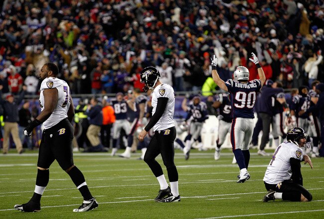 FOXBORO, MA - JANUARY 22:   Niko Koutouvides #90 of the New England Patriots celebrate after Billy Cundiff (C) #7 of the Baltimore Ravens missed a game tying field goal late in the fourth quarter during their AFC Championship Game at Gillette Stadium on January 22, 2012 in Foxboro, Massachusetts.  (Photo by Rob Carr/Getty Images)