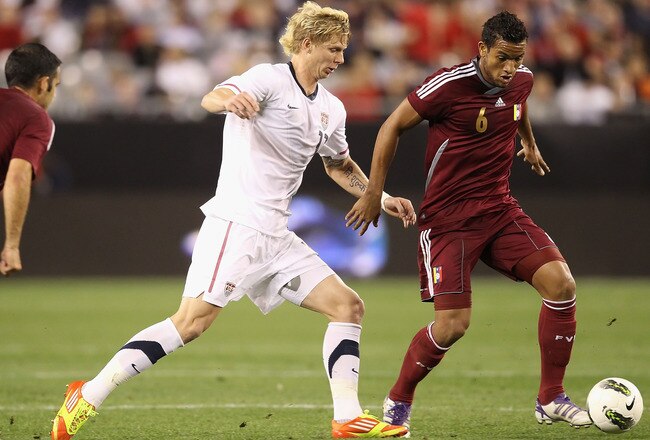 GLENDALE, AZ - JANUARY 21:  Agnel Flores of Venezuela controls the ball under pressure from  Brek Shea #11 of USA during the friendly match at University of Phoenix Stadium on January 21, 2012 in Glendale, Arizona.  USA defeated Venezuela 1-0.  (Photo by Christian Petersen/Getty Images)