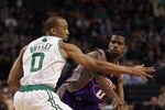 BOSTON, MA - MARCH 02:  Aaron Brooks #0 of the Phoenix Suns passes the ball around Avery Bradley #0 of the Boston Celtics on March 2, 2011 at the TD Garden in Boston, Massachusetts.  The Celtics defeated the Suns 115-103. NOTE TO USER: User expressly acknowledges and agrees that, by downloading and/or using this Photograph, User is consenting to the terms and conditions of the Getty Images License Agreement.  (Photo by Elsa/Getty Images)