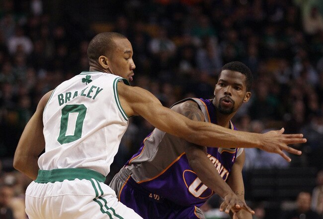 BOSTON, MA - MARCH 02:  Aaron Brooks #0 of the Phoenix Suns passes the ball around Avery Bradley #0 of the Boston Celtics on March 2, 2011 at the TD Garden in Boston, Massachusetts.  The Celtics defeated the Suns 115-103. NOTE TO USER: User expressly acknowledges and agrees that, by downloading and/or using this Photograph, User is consenting to the terms and conditions of the Getty Images License Agreement.  (Photo by Elsa/Getty Images)