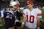 FOXBORO, MA - NOVEMBER 6:    Tom Brady #12 of the New England Patriots congratulates  Eli Manning #10 of the New York Giants after the New York Giants 24-20 win on November 6, 2011 in Foxboro, Massachusetts. (Photo by Jim Rogash/Getty Images)