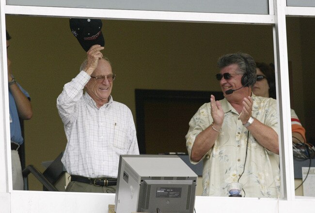 DETROIT - JULY 21:  Hall of Fame broadcaster, Ernie Harwell tips his cap as he receives a standing ovation from the crowd in this, his last season at Comerica Park in Detroit, Michigan on July 21, 2002.  The Twins dfeated the Tigers 4-2.  (Photo by Tom Pidgeon/Getty Images)