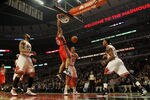 CHICAGO, IL - JANUARY 23:  Kris Humphries #43 of the New Jersey Nets dunks the ball over Carlos Boozer #5, Joakim Noah #13 and Derrick Rose #1 of the Chicago Bulls at the United Center on January 23, 2012 in Chicago, Illinois. NOTE TO USER: User expressly acknowledges and agrees that, by downloading and or using this photograph, User is consenting to the terms and conditions of the Getty Images License Agreement.  (Photo by Jonathan Daniel/Getty Images)