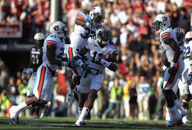 COLUMBIA, SC - OCTOBER 01:  Demetruce McNeal #12 of the Auburn Tigers celebrates with Jermaine Whitehead #32 of the Auburn Tigers after an interception during their game against the South Carolina Gamecocks at Williams-Brice Stadium on October 1, 2011 in Columbia, South Carolina.  (Photo by Streeter Lecka/Getty Images)