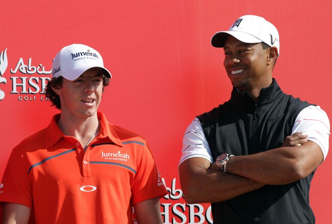 ABU DHABI, UNITED ARAB EMIRATES - JANUARY 24:  Rory McIlroy of Northern Ireland (L) chats to Tiger Woods of the USA during a preview photocall for the 2012 Abu Dhabi HSBC Golf Championship at the Abu Dhabi Golf Club on January 24, 2012 in Abu Dhabi, United Arab Emirates.  (Photo by Ross Kinnaird/Getty Images)