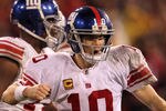 SAN FRANCISCO, CA - JANUARY 22:  Eli Manning #10 of the New York Giants reacts after he threw a 17-yard touchdown reception in the fourth quarter to Mario Manningham #82 against the San Francisco 49ers during the NFC Championship Game at Candlestick Park on January 22, 2012 in San Francisco, California.  (Photo by Jamie Squire/Getty Images)