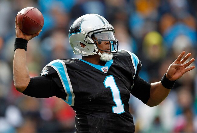 CHARLOTTE, NC - DECEMBER 24:  Cam Newton #1 of the Carolina Panthers drops back to pass during their game against the Tampa Bay Buccaneers at Bank of America Stadium on December 24, 2011 in Charlotte, North Carolina.  (Photo by Streeter Lecka/Getty Images)