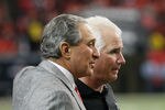 ATLANTA, GA - JANUARY 02:  Head coach Mike Smith and Owner and CEO Arthur Blank of the Atlanta Falcons celebrate in the final seconds of their 31-10 win over the Carolina Panthers at Georgia Dome on January 2, 2011 in Atlanta, Georgia.  (Photo by Kevin C. Cox/Getty Images)