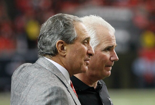 ATLANTA, GA - JANUARY 02:  Head coach Mike Smith and Owner and CEO Arthur Blank of the Atlanta Falcons celebrate in the final seconds of their 31-10 win over the Carolina Panthers at Georgia Dome on January 2, 2011 in Atlanta, Georgia.  (Photo by Kevin C. Cox/Getty Images)