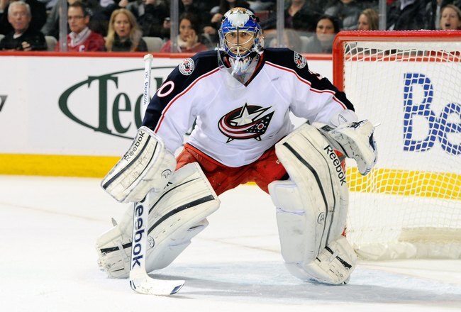 MONTREAL, CANADA - DECEMBER 6:  Curtis Sanford #30 of the Columbus Blue Jackets watches play during the NHL game against the Montreal Canadiens at the Bell Centre on December 6, 2011 in Montreal, Quebec, Canada.  The Blue Jackets defeated the Canadiens 3-2 in a shootout.  (Photo by Richard Wolowicz/Getty Images)