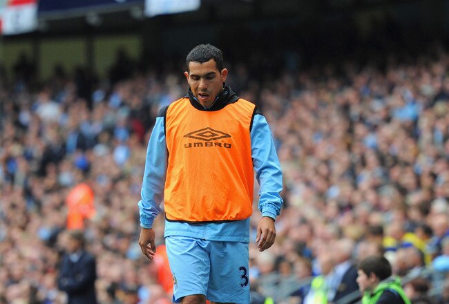 MANCHESTER, ENGLAND - SEPTEMBER 24:  Carlos Tevez of Manchester City looks on from the sidelines during the Barclays Premier League match between Manchester City and Everton at the Etihad Stadium on September 24, 2011 in Manchester, England.  (Photo by Michael Regan/Getty Images)