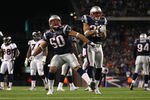FOXBORO, MA - JANUARY 14:  Rob Ninkovich #50 and Patrick Chung #25 of the New England Patriots react against a defensive play against the Denver Broncos during their AFC Divisional Playoff Game at Gillette Stadium on January 14, 2012 in Foxboro, Massachusetts.  (Photo by Al Bello/Getty Images)