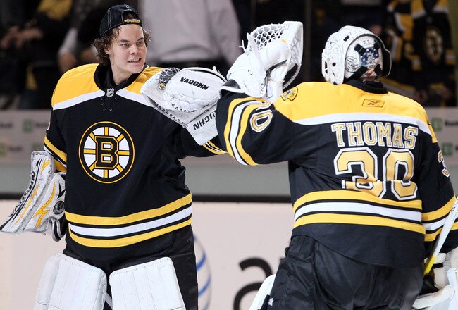 BOSTON, MA - APRIL 23:  Tuukka Rask #40 of the Boston Bruins congratulates Tim Thomas #30 after the game against the Montreal Canadiens after Game Five of the Eastern Conference Quarterfinals during the 2011 NHL Stanley Cup Playoffs at TD Garden on April 23, 2011 in Boston, Massachusetts. The Boston Bruins defeated the Montreal Canadiens 2-1 in double overtime.  (Photo by Elsa/Getty Images)