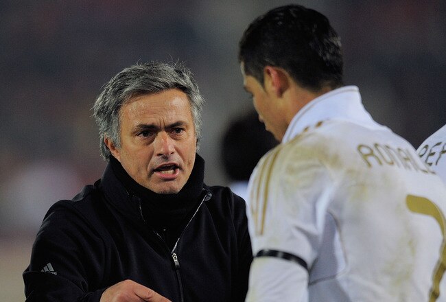 PALMA DE MALLORCA, SPAIN - JANUARY 14: Real Madrid head coach Jose Mourinho has a word with Cristiano Ronaldo during the La Liga match between RCD Mallorca and Real Madrid at Iberostar Stadium on January 14, 2012 in Palma de Mallorca, Spain.  (Photo by Denis Doyle/Getty Images)