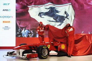 MARANELLO, ITALY - JANUARY 28:  In this handout image supplied by Ferrari, Fernando Alonso (L) of Spain and Felipe Massa (R) of Brazil unveil the new Ferrari F150 at its launch on January 28, 2011 in Maranello, Italy.  (Photo by Ercole Colombo/Ferrari via Getty Images)