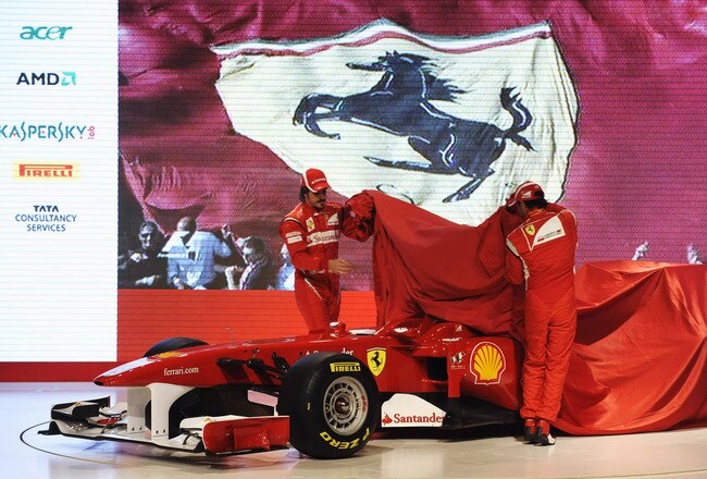MARANELLO, ITALY - JANUARY 28:  In this handout image supplied by Ferrari, Fernando Alonso (L) of Spain and Felipe Massa (R) of Brazil unveil the new Ferrari F150 at its launch on January 28, 2011 in Maranello, Italy.  (Photo by Ercole Colombo/Ferrari via Getty Images)