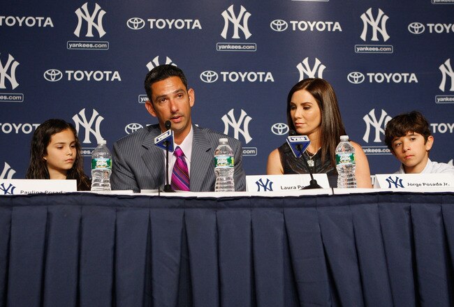 NEW YORK, NY - JANUARY 24:  Jorge Posada addresses the media during a press conference to announces his retirement from the New York Yankees as his wife Laura Posada, his son Jorge Jr. and daughter Paulina look on at Yankee Stadium on January 24, 2012 in the Bronx borough of  New York City.  (Photo by Mike Stobe/Getty Images)