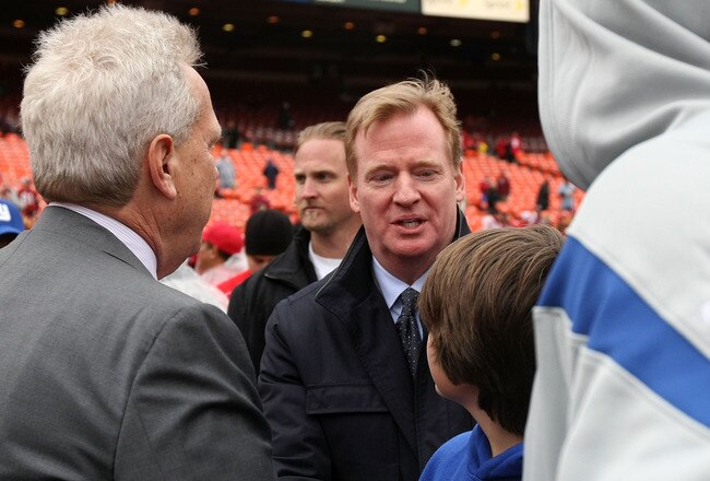 SAN FRANCISCO, CA - JANUARY 22:  NFL Commissioner Roger Goodell (C) greets Chairman of the New York Giants Steve Tisch (L) on the field prior to the Giants playing against the San Francisco 49ers during the NFC Championship Game at Candlestick Park on January 22, 2012 in San Francisco, California.  (Photo by Doug Pensinger/Getty Images)