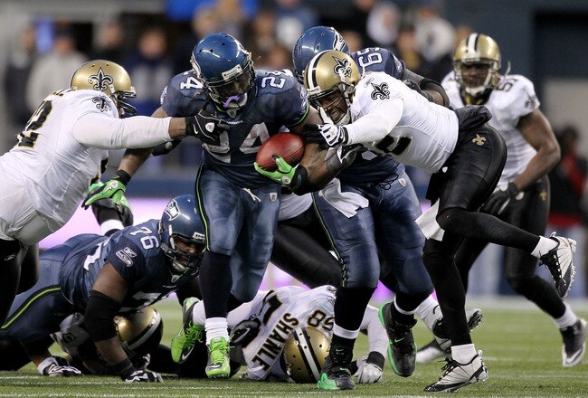 SEATTLE, WA - JANUARY 08:  Running back Marshawn Lynch #24 of the Seattle Seahawks runs for a 67-yard touchdown run in the fourth quarter against the New Orleans Saints during the 2011 NFC wild-card playoff game at Qwest Field on January 8, 2011 in Seattle, Washington.  (Photo by Otto Greule Jr/Getty Images)