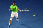MELBOURNE, AUSTRALIA - JANUARY 24:  Rafael Nadal of Spain plays a forehand in his quarter final match against Tomas Berdych of the Czech Republic during day nine of the 2012 Australian Open at Melbourne Park on January 24, 2012 in Melbourne, Australia.  (Photo by Mark Dadswell/Getty Images)